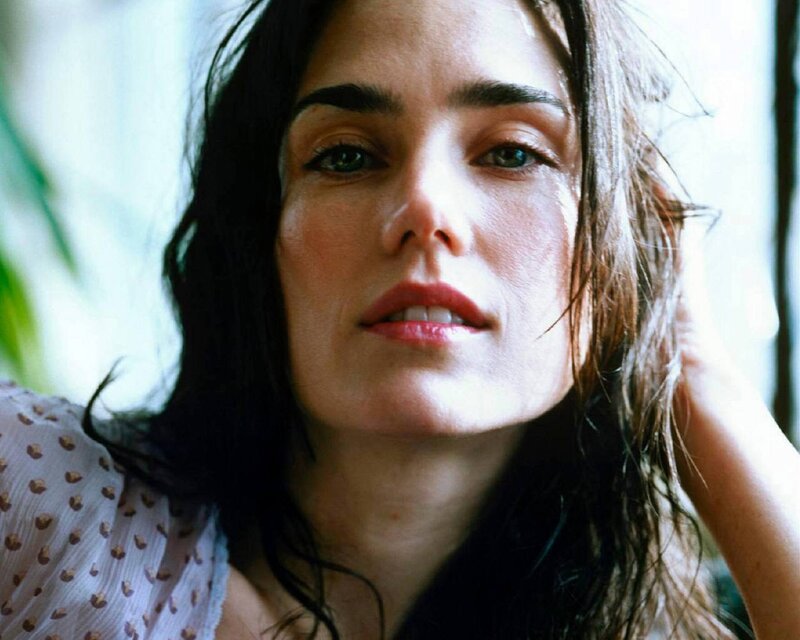 woman with dark hair looking at camera