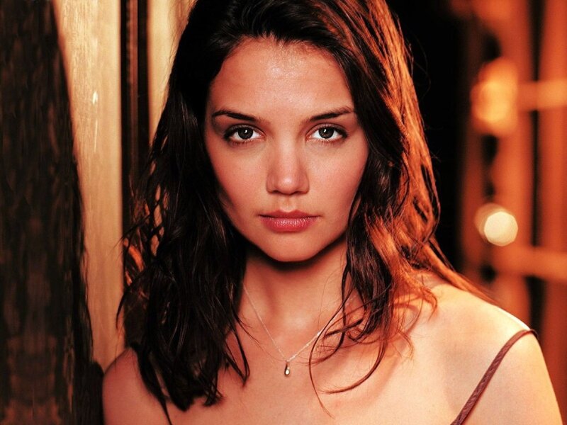 woman with dark hair looking at camera