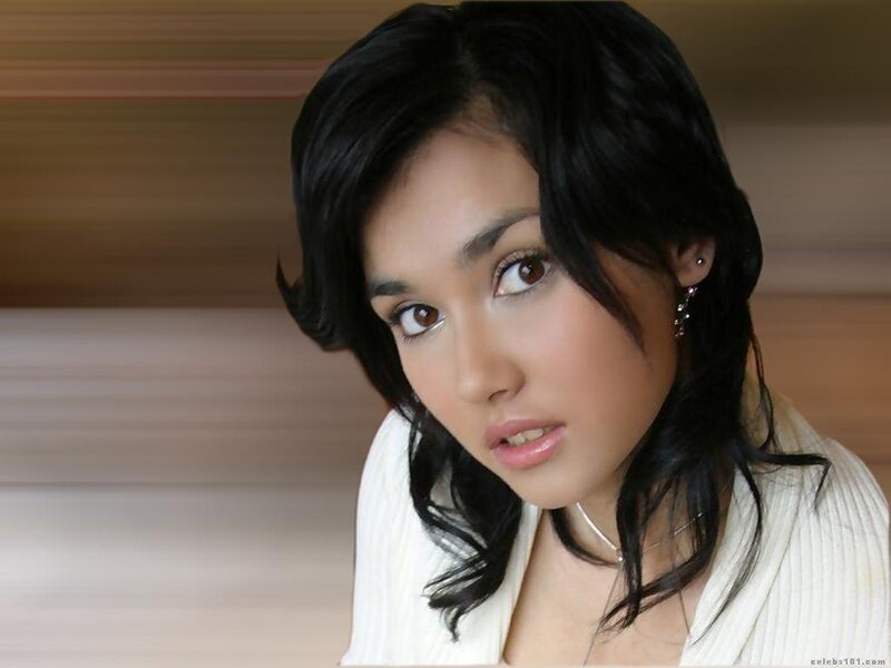woman with dark hair looking at camera