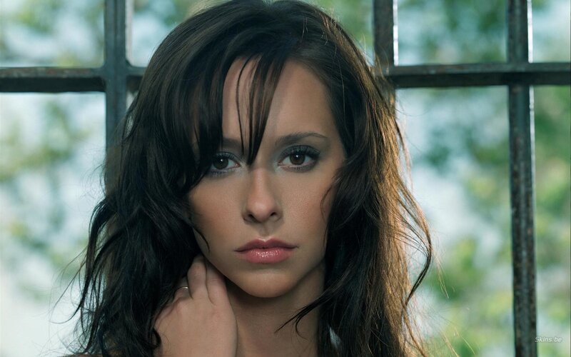 woman with dark hair looking at camera