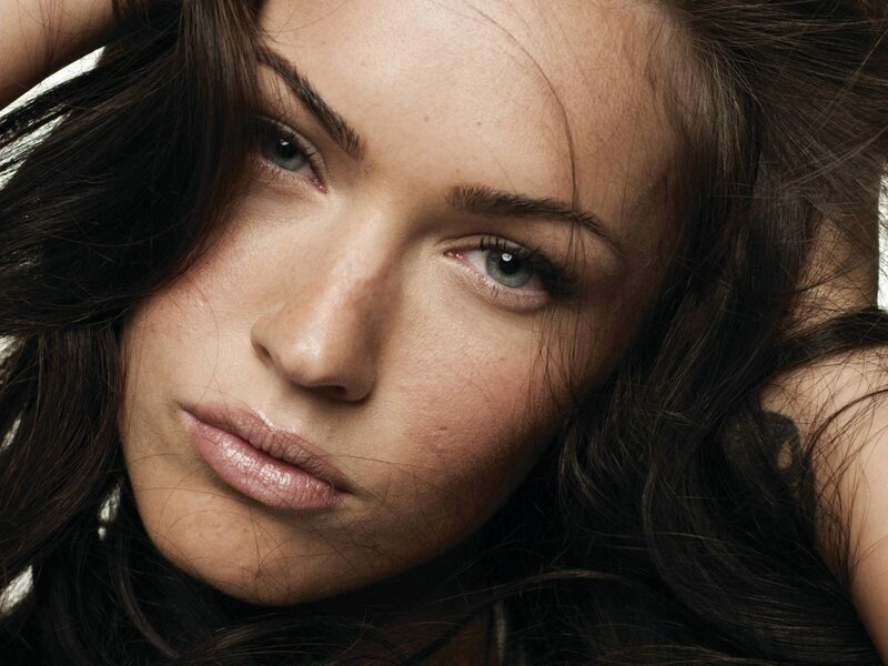 woman with dark hair looking at camera