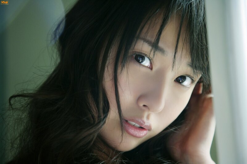 woman with dark hair looking at camera