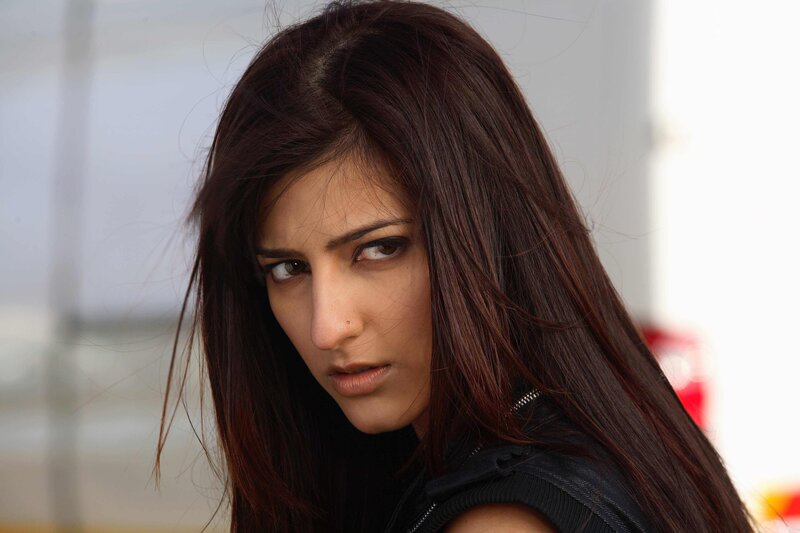 woman with dark hair looking at camera