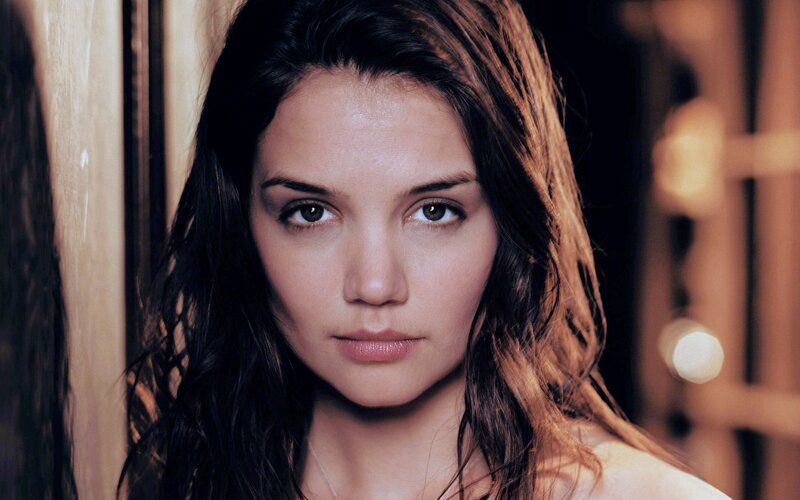 woman with dark hair looking at camera