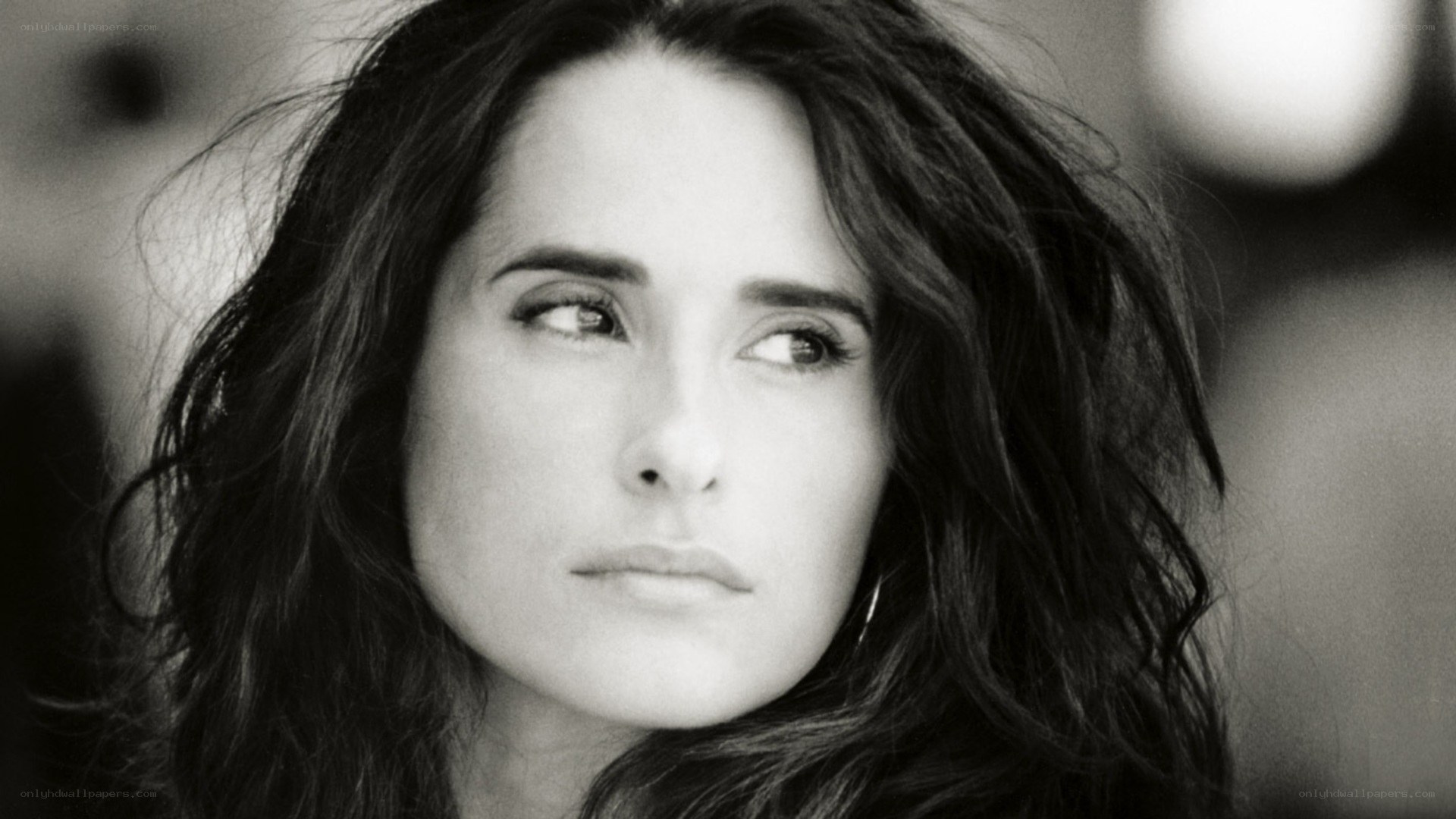 woman with dark hair looking away