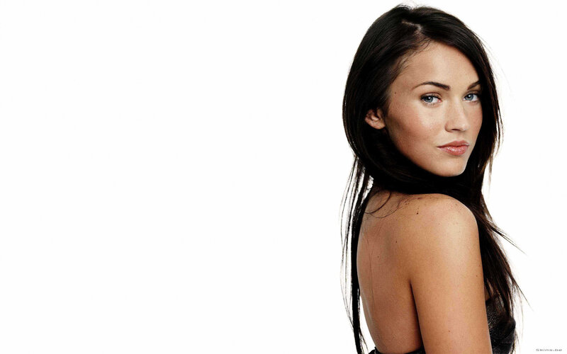 woman with dark hair looking back