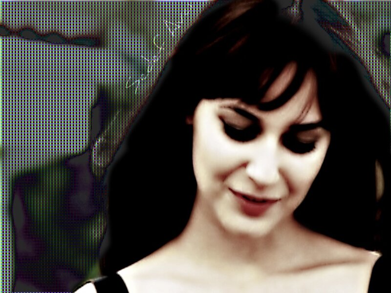 woman with dark hair looking down
