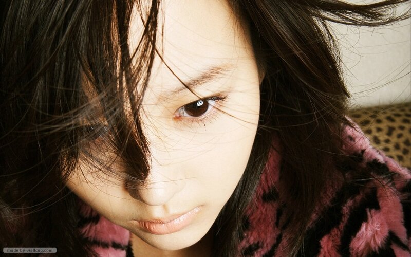 woman with dark hair looking down