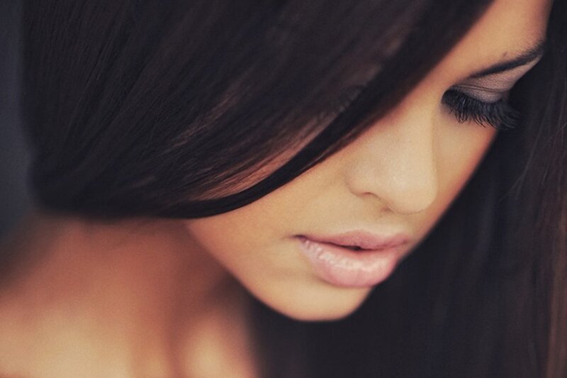 woman with dark hair looking down