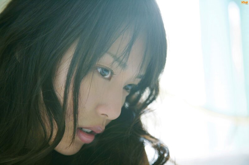 woman with dark hair looking down