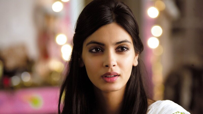 woman with dark hair looking forward