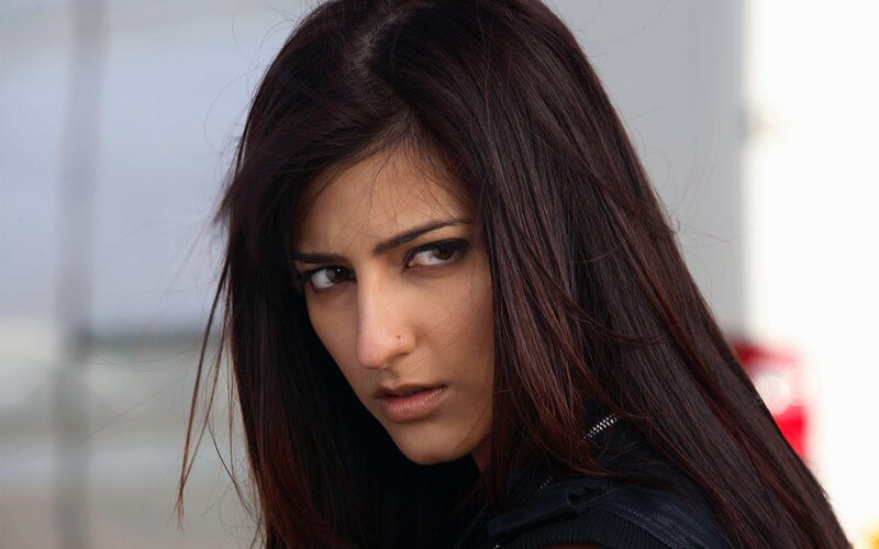 woman with dark hair looking intensely