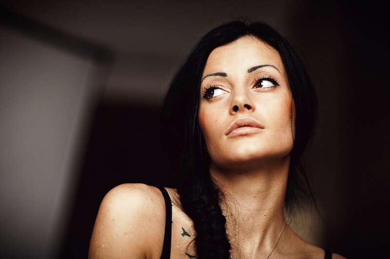woman with dark hair looking up