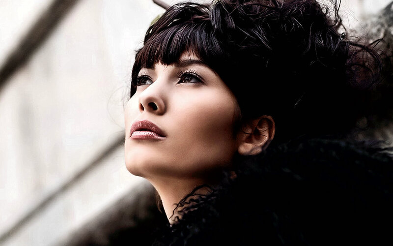 woman with dark hair looking up