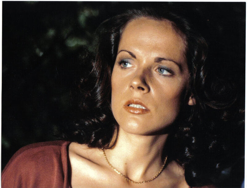 woman with dark hair looking up