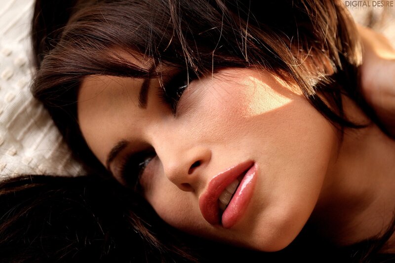 woman with dark hair lying down