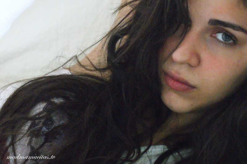 woman with dark hair lying down