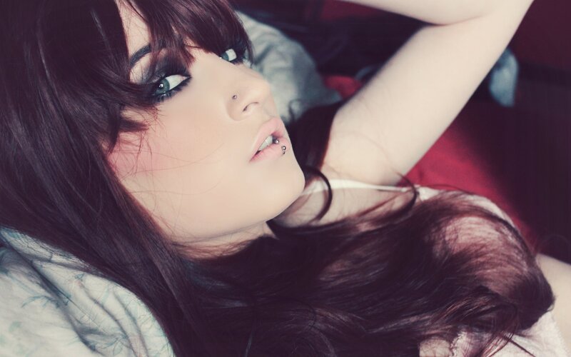 woman with dark hair lying down