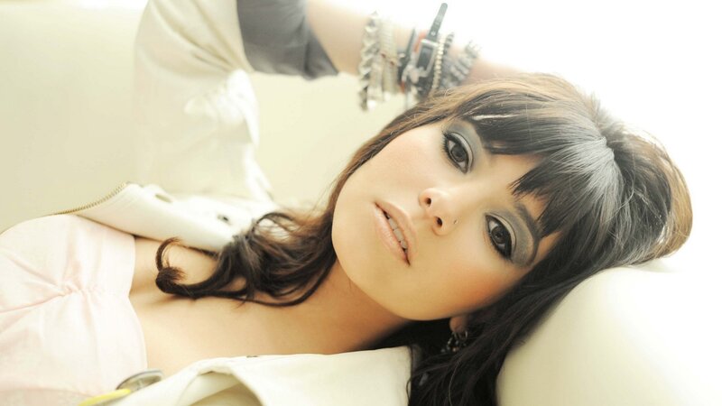 woman with dark hair lying down