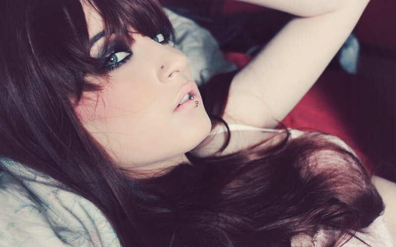 woman with dark hair lying down