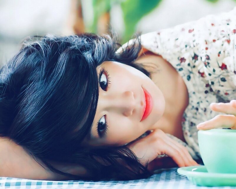 woman with dark hair lying down