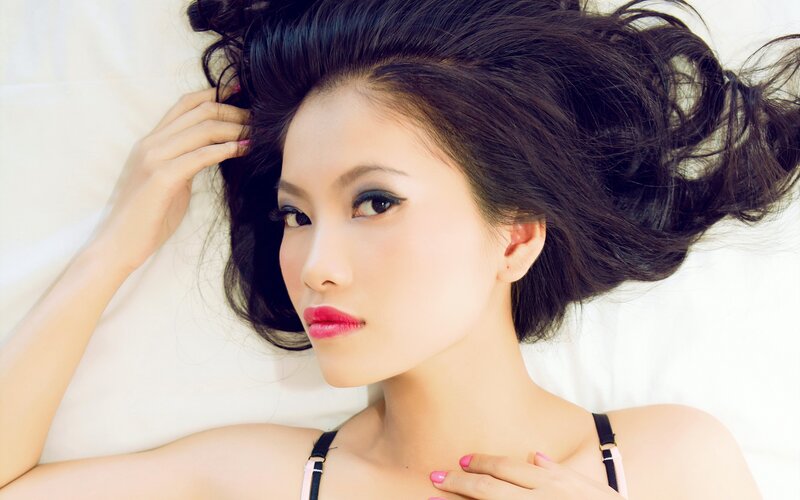 woman with dark hair lying down