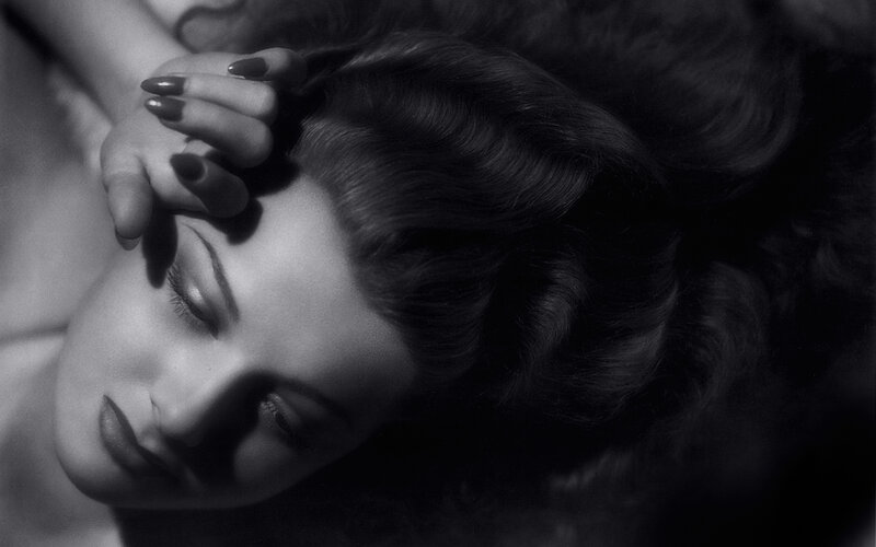 woman with dark hair lying down