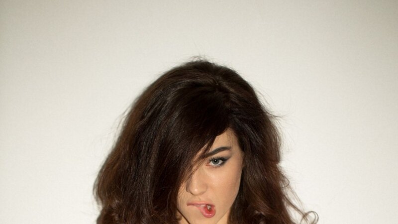 woman with dark hair making a face