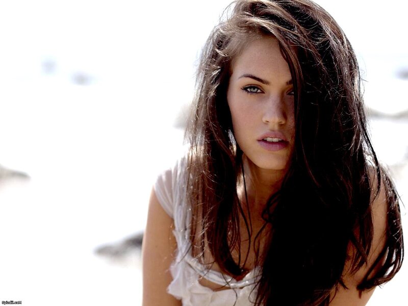 woman with dark hair on beach