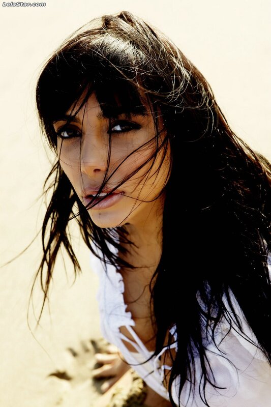 woman with dark hair on beach