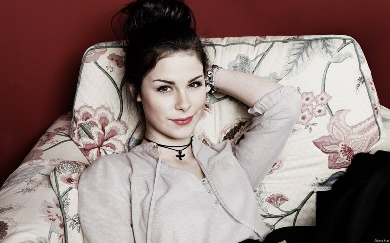 woman with dark hair on floral couch
