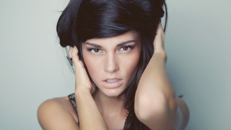 woman with dark hair posing