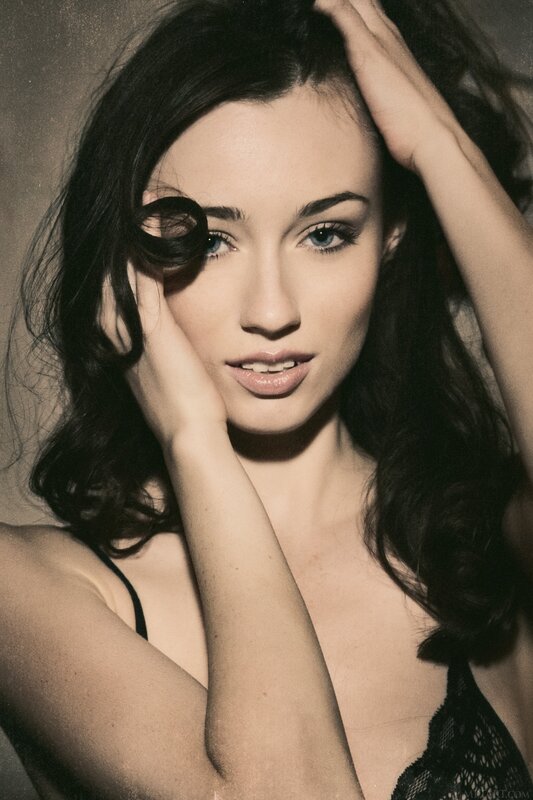 woman with dark hair posing