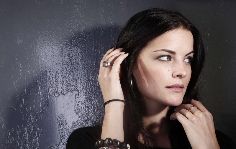 woman with dark hair posing