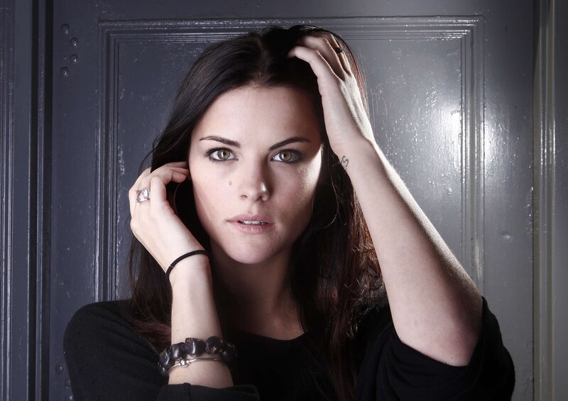 woman with dark hair posing