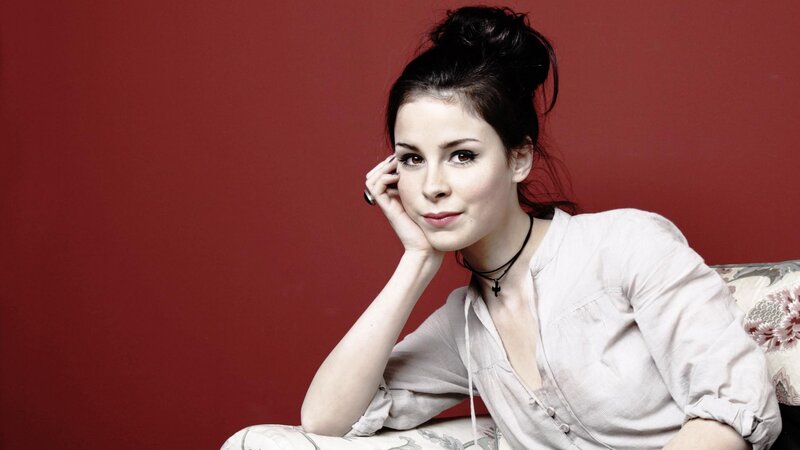 woman with dark hair posing
