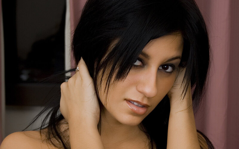 woman with dark hair posing
