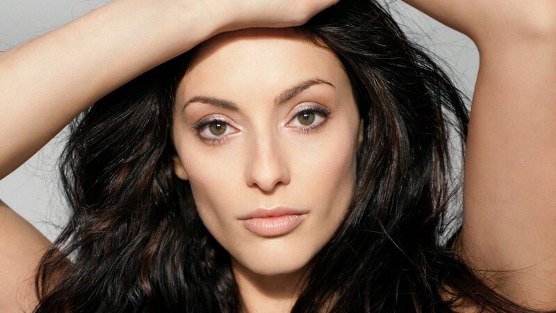 woman with dark hair posing