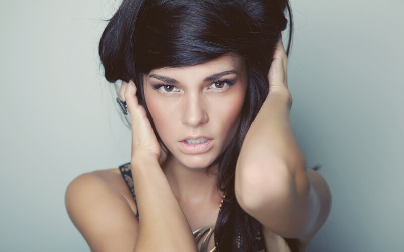 woman with dark hair posing