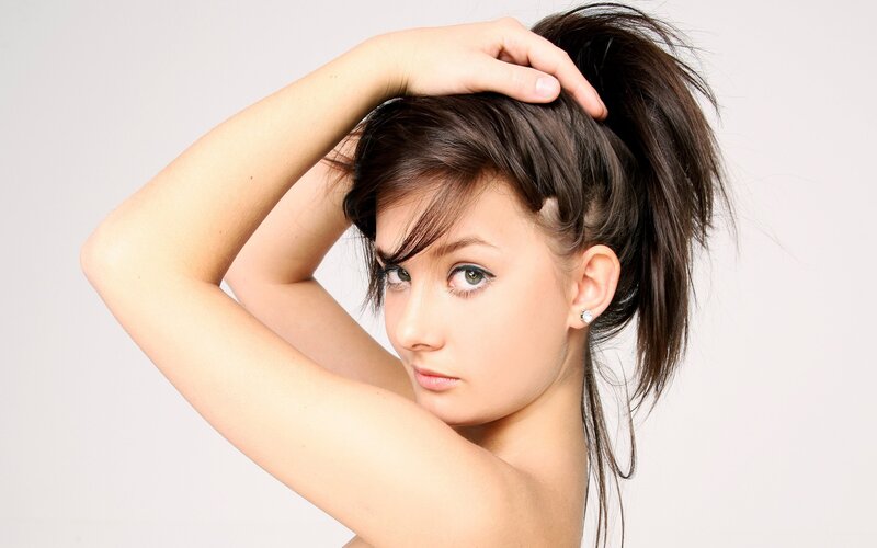 woman with dark hair posing