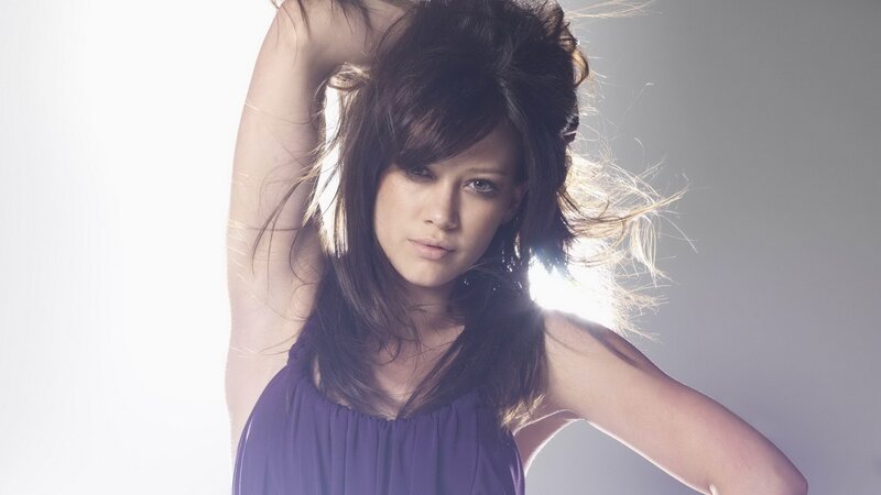 Woman with Dark Hair — Purple, Dramatic, Photograph, Purple Top, Light Background