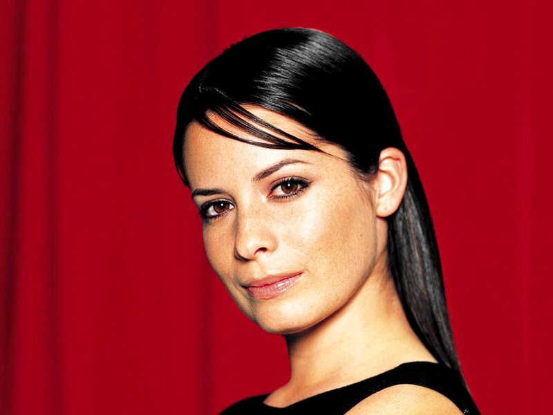 Woman with Dark Hair — Red, Neutral, Photograph, Red Background, Black Top