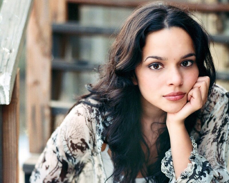 woman with dark hair resting her chin