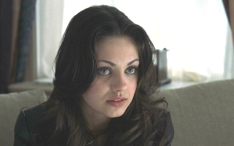 woman with dark hair sitting