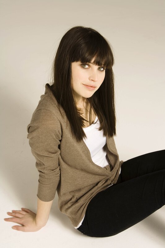 woman with dark hair sitting
