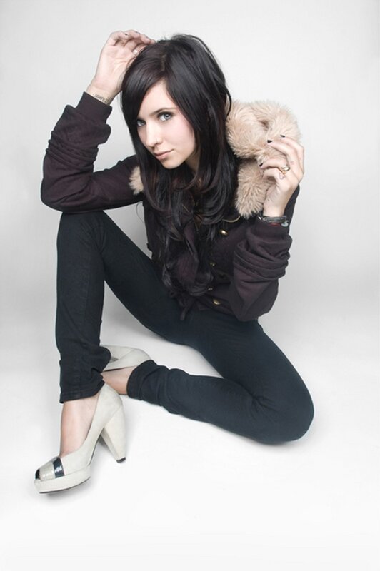 woman with dark hair sitting