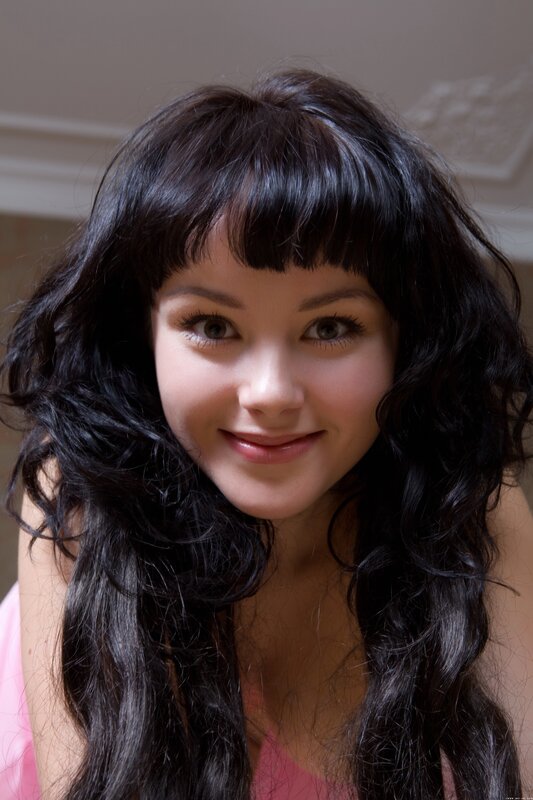 woman with dark hair smiling