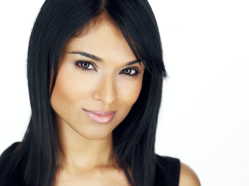 woman with dark hair smiling