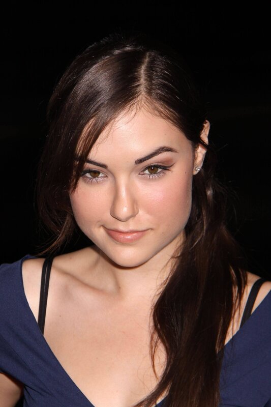 woman with dark hair smiling