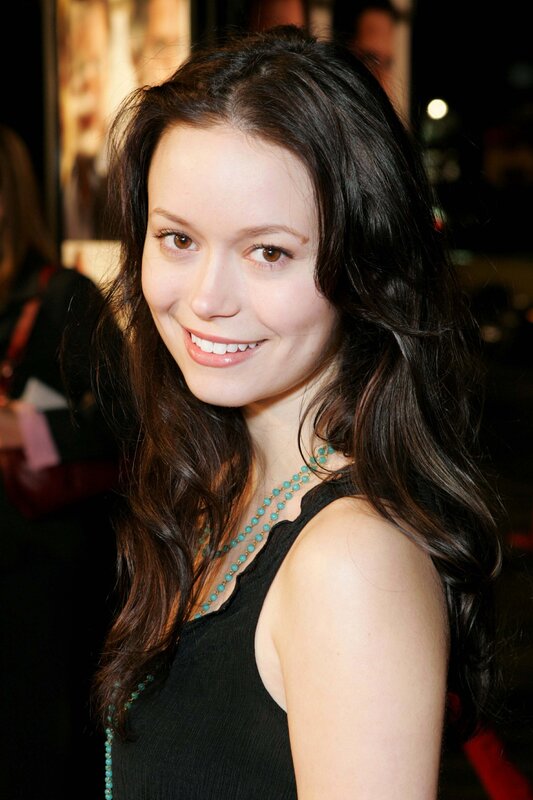woman with dark hair smiling